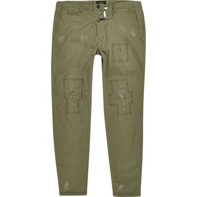 Khaki green distressed skinny trousers